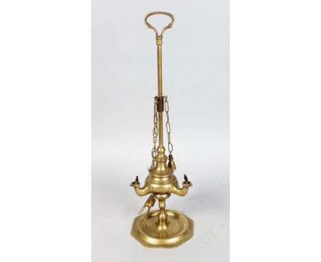 A BRASS OIL LAMP.  17ins high.