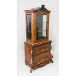A 19TH CENTURY DUTCH WALNUT AND FLORAL MARQUETRY CABINET ON CHEST, the upper part with carved