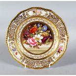 A STEVENS & HANCOCK PORCELAIN PLATE, the border with gilt decoration and three floral vignettes,