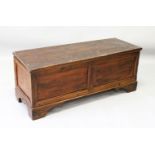 AN 18TH CENTURY COFFER, with plain top and two panels to the front, supported on bracket feet. 3ft