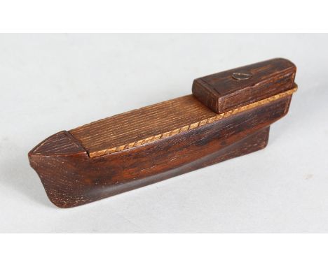 A WOODEN SNUFF BOX, carved as a boat. 4.5ins long.