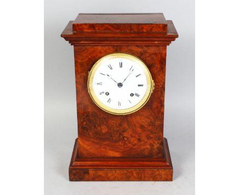 A 19TH CENTURY FRENCH WALNUT MANTLE CLOCK, with eight-day movement, white dial, black Roman numerals. 13ins high.