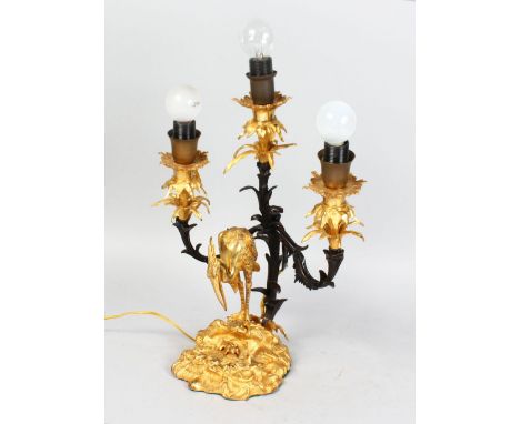 A GOOD FRENCH ORMOLU AND BRONZE THREE-LIGHT CANDELABRA, with three scrolling branches, the base with a heron, converted to el