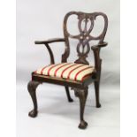 A GEORGE II MAHOGANY ARMCHAIR, with pierced shaped back, carved curving arms, drop-in seat,