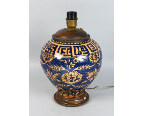 A BULBOUS ISLAMIC POTTERY VASE, converted to a lamp. 12ins high.