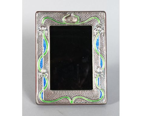AN ART NOUVEAU SILVER AND ENAMEL PHOTOGRAPH FRAME. 7.5ins x 5.5ins.
