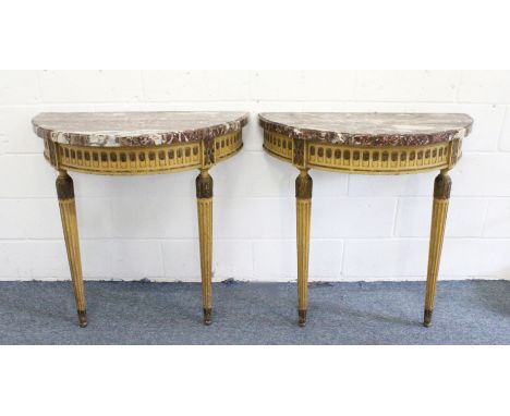 A GOOD PAIR OF GEORGE III DEMILUNE CONSOLE TABLE, with marble tops, painted and carved decoration, tulips to the frieze and s