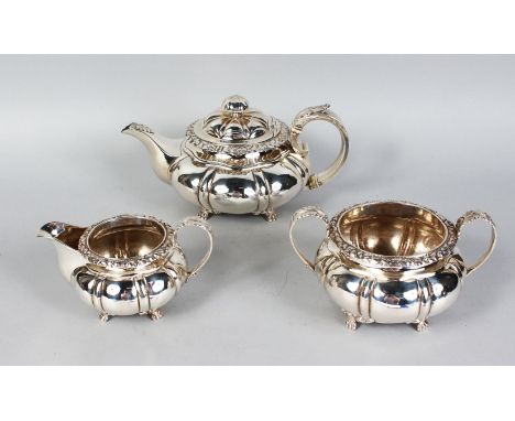 AN IRISH GEORGE IV THREE PIECE TEA SET, comprising teapot, sugar basin and milk jug. Dublin 1827.  Maker: R. C.  Weight 46ozs