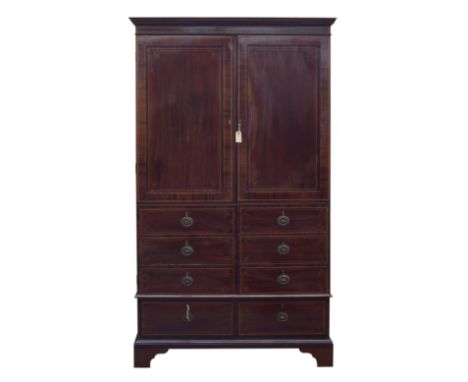 A 19th century mahogany linen press, the two doors with six blind drawers over two drawers, on bracket feet, 122cm wide, 62cm