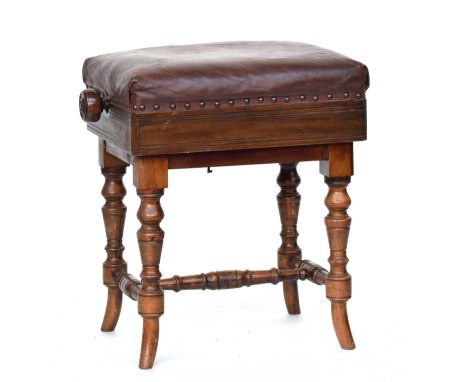 An early 20th century adjustable piano stool, leather upholstered seat on turned legs, 43cm wide 