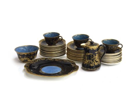 An early 20th century Crown Staffordshire 38 piece part tea service, black and cobalt blue Chinoiserie design, heightened in 