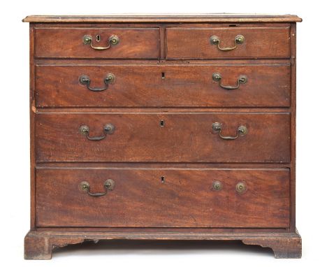 A George III mahogany chest of two short over three graduating drawers, on bracket feet, the crossbanded top with with barber