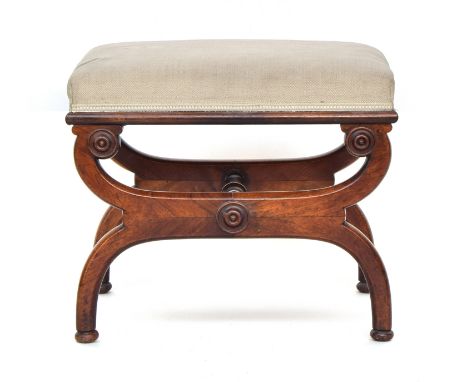 A Regency mahogany x-frame stool, of rectangular form, the legs united by a turned stretcher, 53cm wide, 43cm deep, 45cm high