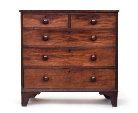 An early Victorian mahogany chest of two short over three long drawers, the top with Greek key frieze banding, on bracket fee