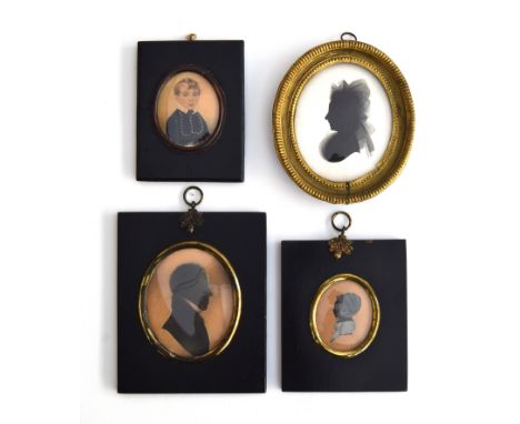 A collection of three early 19th century miniatures in ebonised frames: a watercolour portrait of 'Master Vanderwell (1812-18