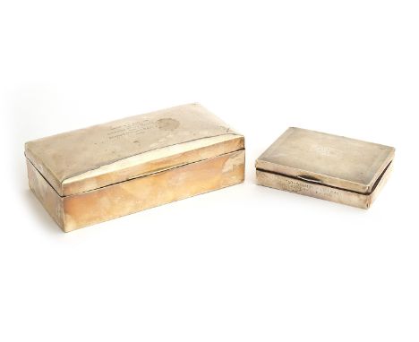 A silver cigarette box, Chester 1919, 17.5cm wide, 9cm deep, 5.5cm high; together with another smaller engine turned box, 11x