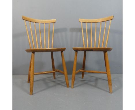 Hagafors, Sweden - A pair of mid-century stick back chairs in the Ercol style with impressed maker’s marks.