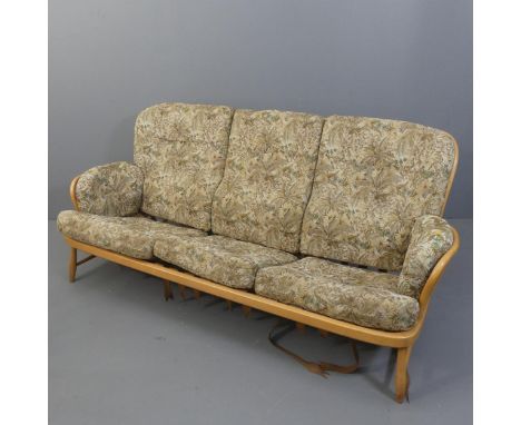ERCOL - A model 766-3 Jubilee three seater sofa. Overall length 196cm, height 83cm, depth 94cm. Webbing A/F.