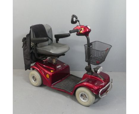 A Rascal TE-388EM mobility scooter with charging cable and carry bag accessories. Currently in working order.