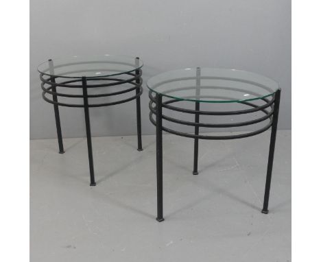A pair of blacksmith hand-forged steel modernist tripod side tables with circular glass tops, in the manner of Pascal Mourgue