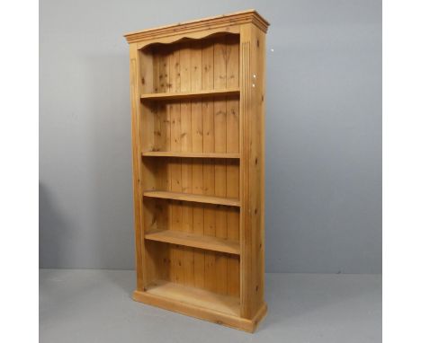 A vintage pine bookcase with 4 adjustable shelves. Width 93cm, Height 185cm, Depth 27cm.