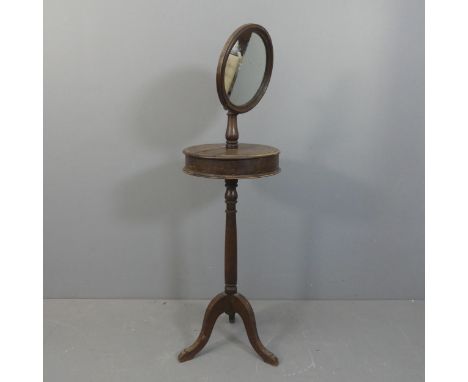 An antique oak shaving stand on turned tripod column. Height as photographed 135cm.