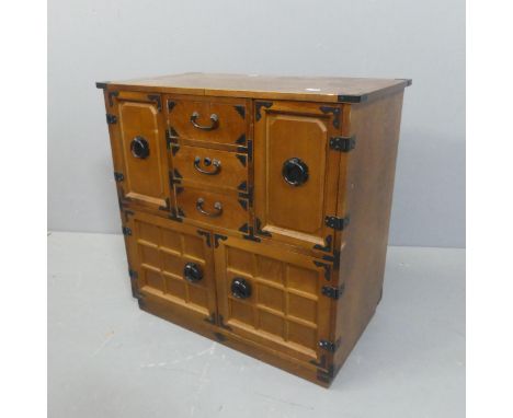 A Japanese hardwood tabletop Haribako Tansu chest, with the drawers and four cupboard doors revealing shelf and drawer fitted