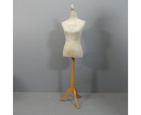 A French shop-display mannequin raised on a turned beech column with tripod base, stamped G. Boussey-Lebel. Height 154cm.