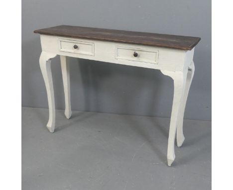 A painted and stained pine console table, with two drawers and cabriole legs. Width 99cm, height 75cm, depth 31cm.