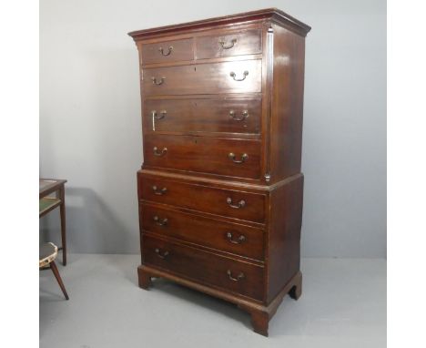 A Georgian mahogany two-section chest-on-chest of two short and six long drawers, with brass pulls and bracket feet. Width 10