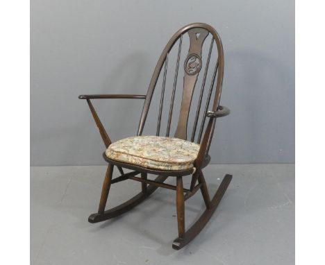 An ERCOL model 891 swan back rocking chair.