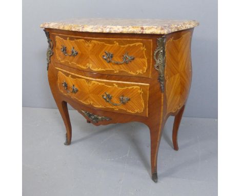 A French Louis XV style kingwood and marble topped commode chest of serpentine form, with two drawers, brass ormolu mounts an