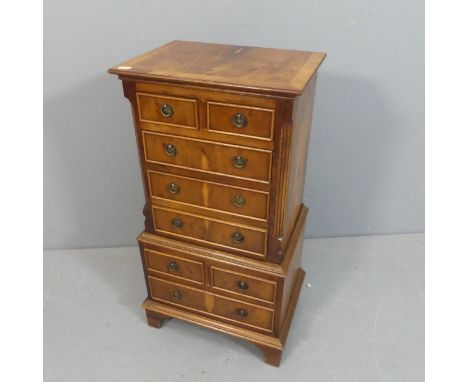 A vintage yew and walnut veneered chest on chest of diminutive proportions. Features four eight drawers in total. Width 42, H
