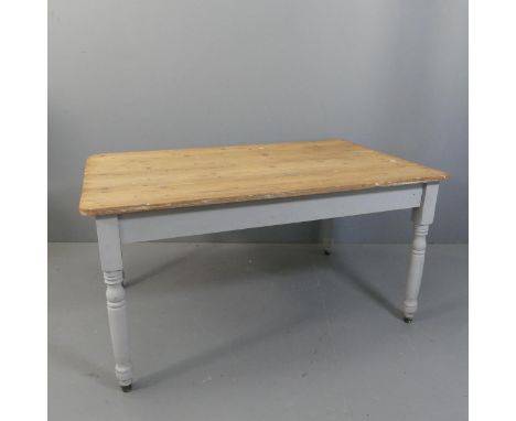 A vintage pine plank top farmhouse kitchen dining table with painted base. Length 137cm, Height 70cm, Depth 88cm.