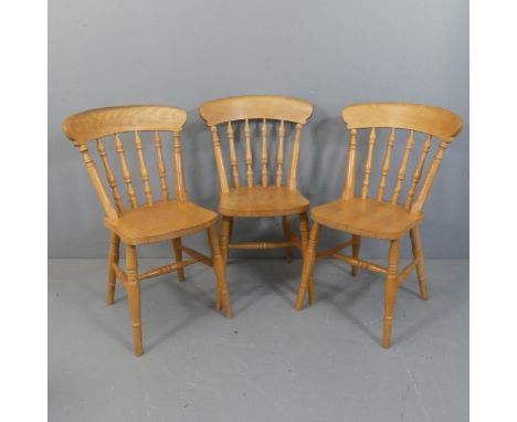 A set of 3 beech stick back kitchen chairs.