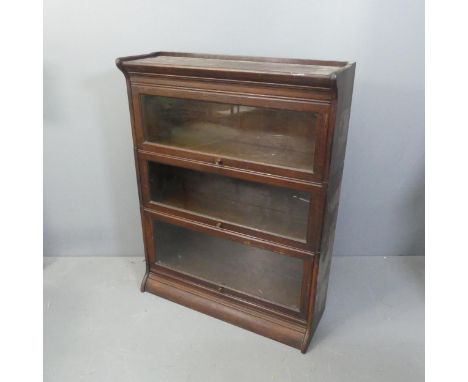 An early 20th century Globe-Wernicke style three shelf sectional stacking bookcase, one shelf impressed "GUMM". Width 87cm, h