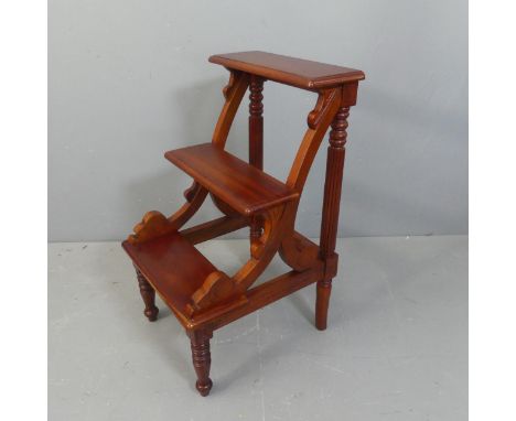 A Regency library step stool. Width 45cm, height 82cm, depth 51cm.