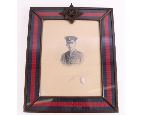 Portrait of Walter Scott Bradford in frame with Irish Guards cap badge surmount.