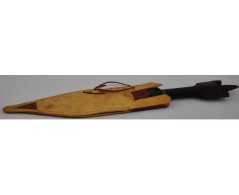 An early 20th Century African dagger with iron mounted horn handle and 23cm steel blade in leather scabbard