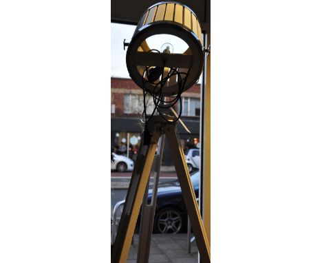 A vintage style chrome and white wood tripod standard lamp modelled as a vintage studio light