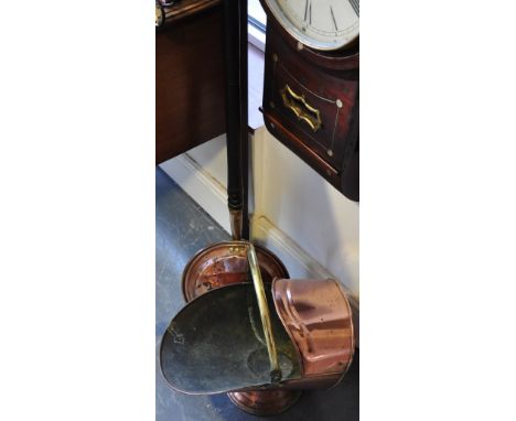 A Victorian helmet shaped brass and copper coal scuttle together with a Victorian copper warming pan with turned wood handle 