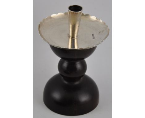 An Edwardian Arts and Crafts silver and lignum vitae candlestick Frederick John Ross, London 1908, h:15cm