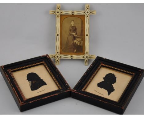 A late 19th Century German portrait Daguerreotype, ivory framed h:14cm, together with a pair of silhouettes depicting Washing