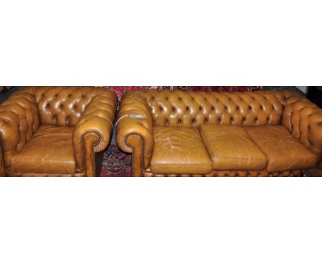 A buttoned Chesterfield 3 seater sofa in tan leather together with a matching club chair