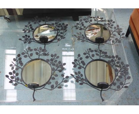 CANDLE WALL SCONCES, a set of four, with circular mirrored plates with a tea light sconce and foliate detail, each 31cm H x 3