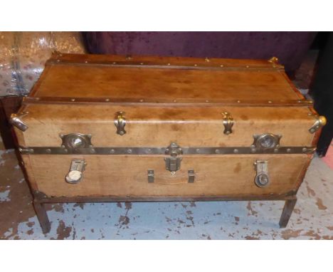 TRAVELLING TAN LEATHER TRUNK, enclosing three sliding trays on an associated metal stand, (can be used as a Low Table), 103cm