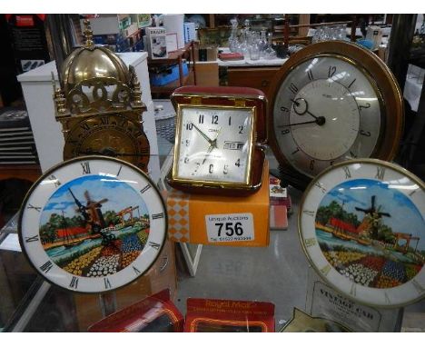 A quantity of vintage mantel clocks including brass Smith's lantern clock.