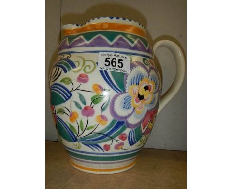 A pottery jug in the style of Poole pottery.