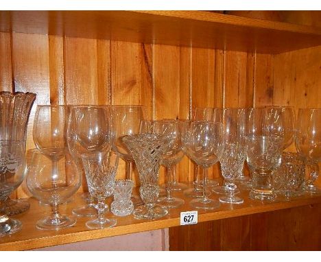 A shelf of assorted drinking glasses. (collect only)