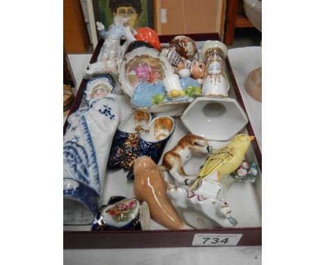 A mixed lot including figures, candlestick etc.,